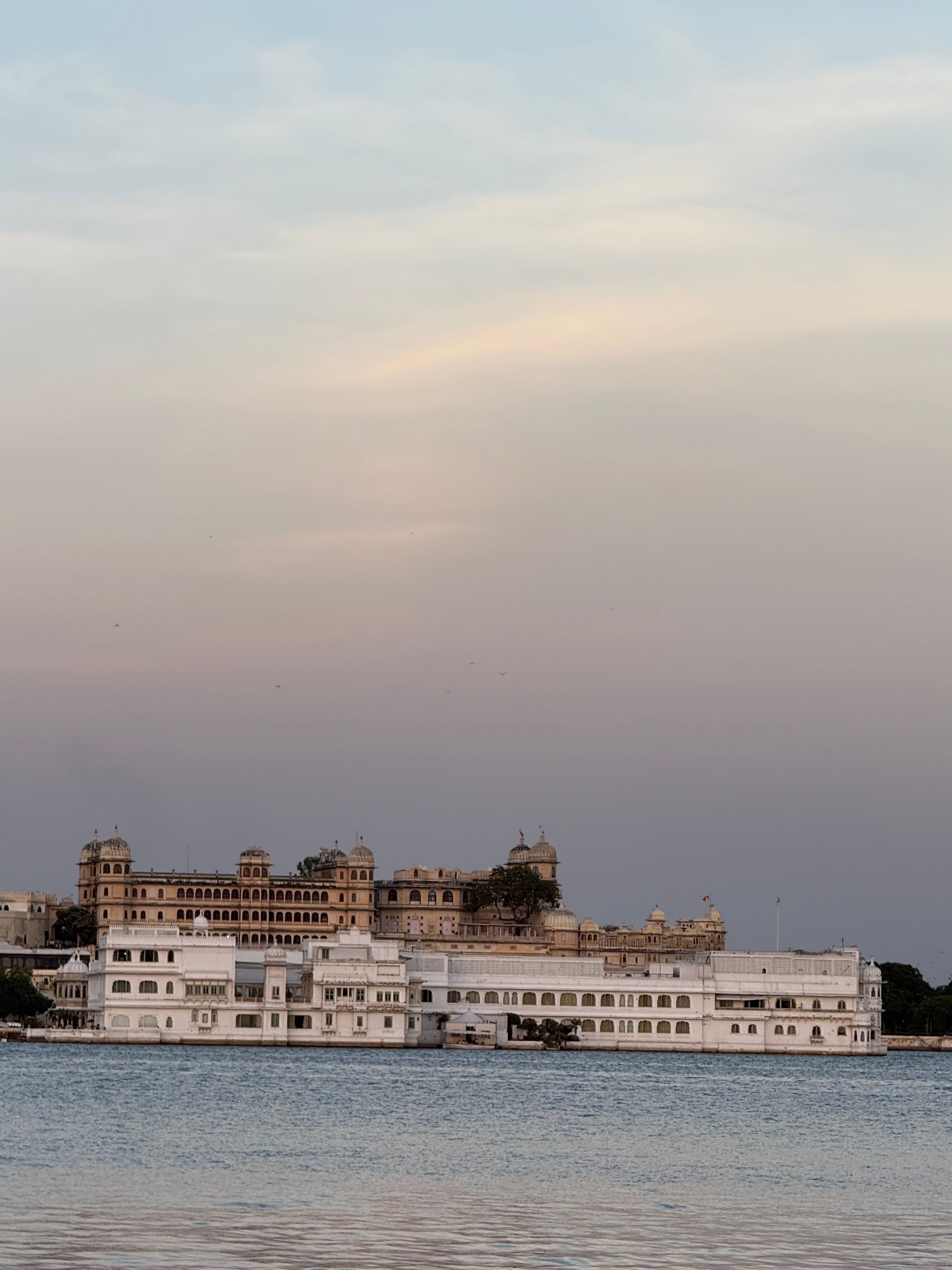 The City Palace and the Lake Palace on Lake Pichola at dusk, Udaipur
