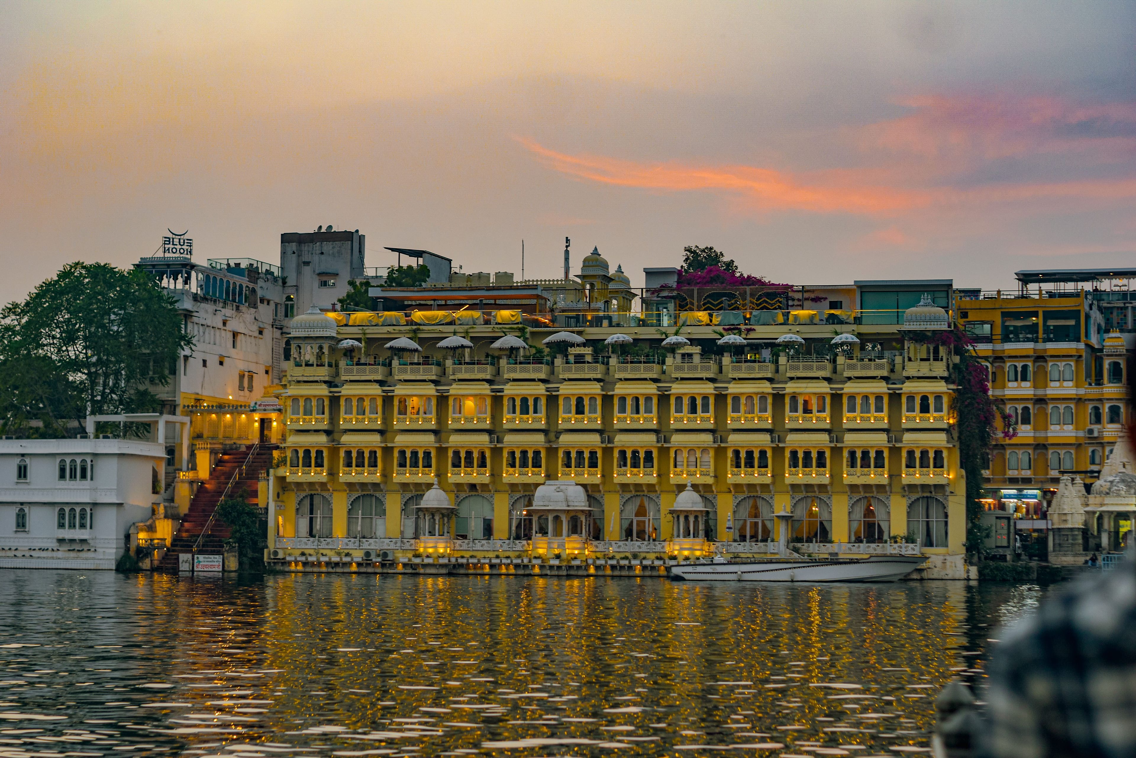A lit haveli on the ghats of Lake Pichola at sunset, Udaipur